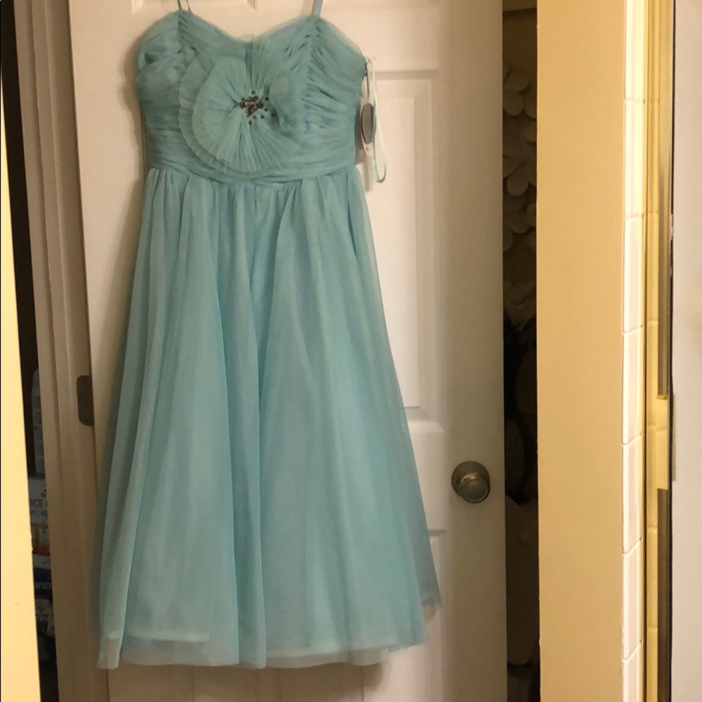 This dress comes to the calf (i’m 66 in. )